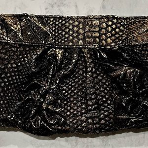 3 genuine chic leather clutches all perfect condition and neutral color ways.